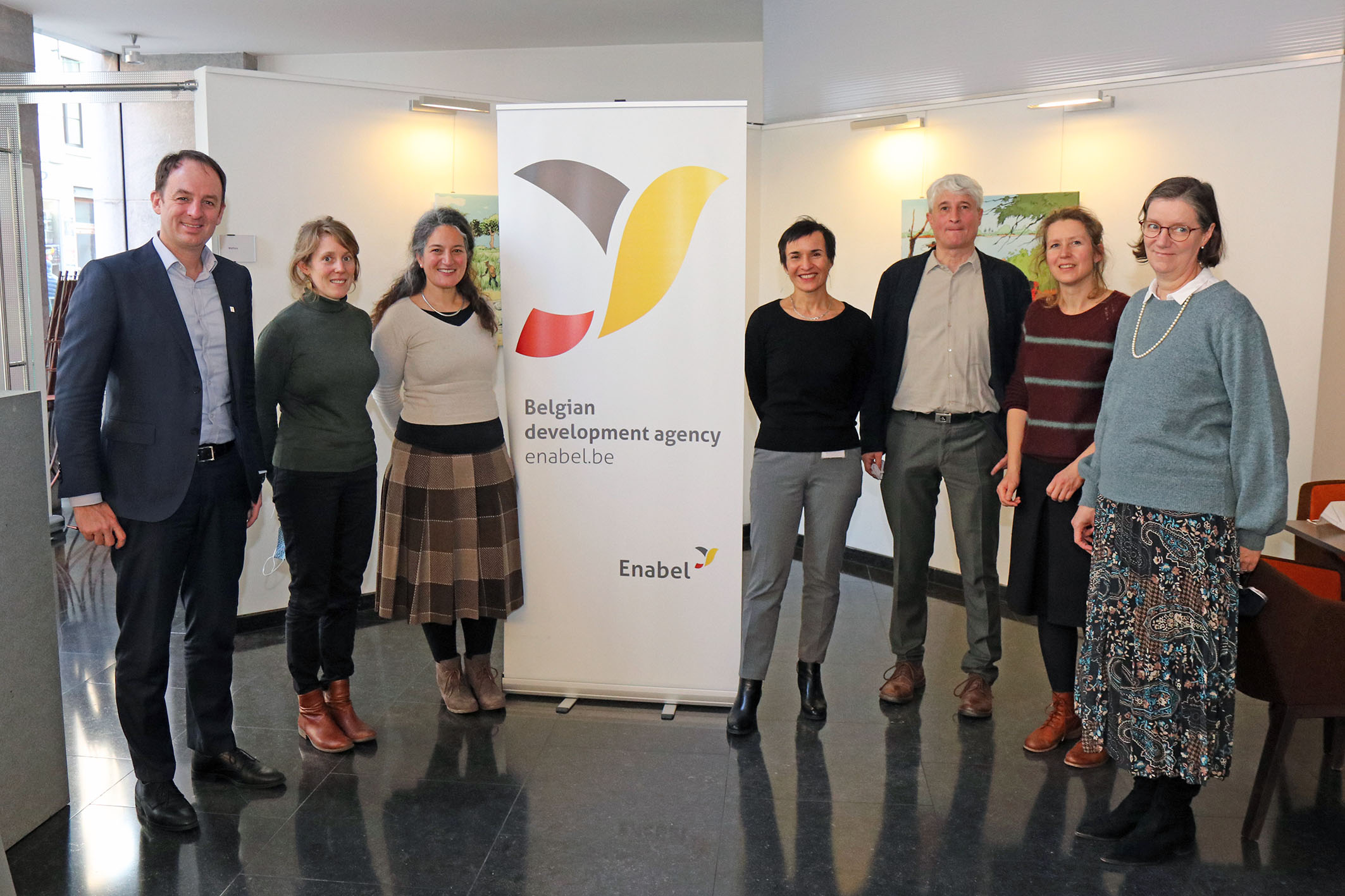 Teams from Enabel and Myria in front of Enabel roll-up