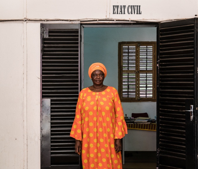 woman standing in front of a civil registry building