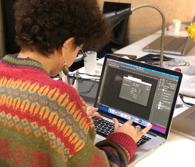 Girl working on a laptop.