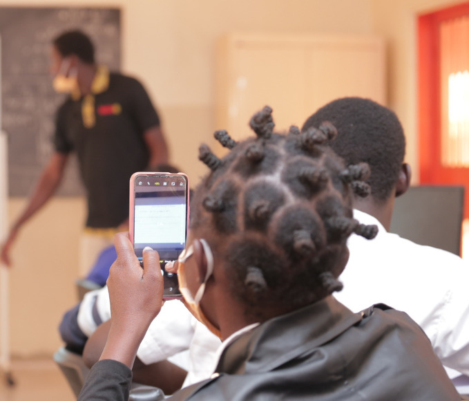 girl taking a picture with her phone