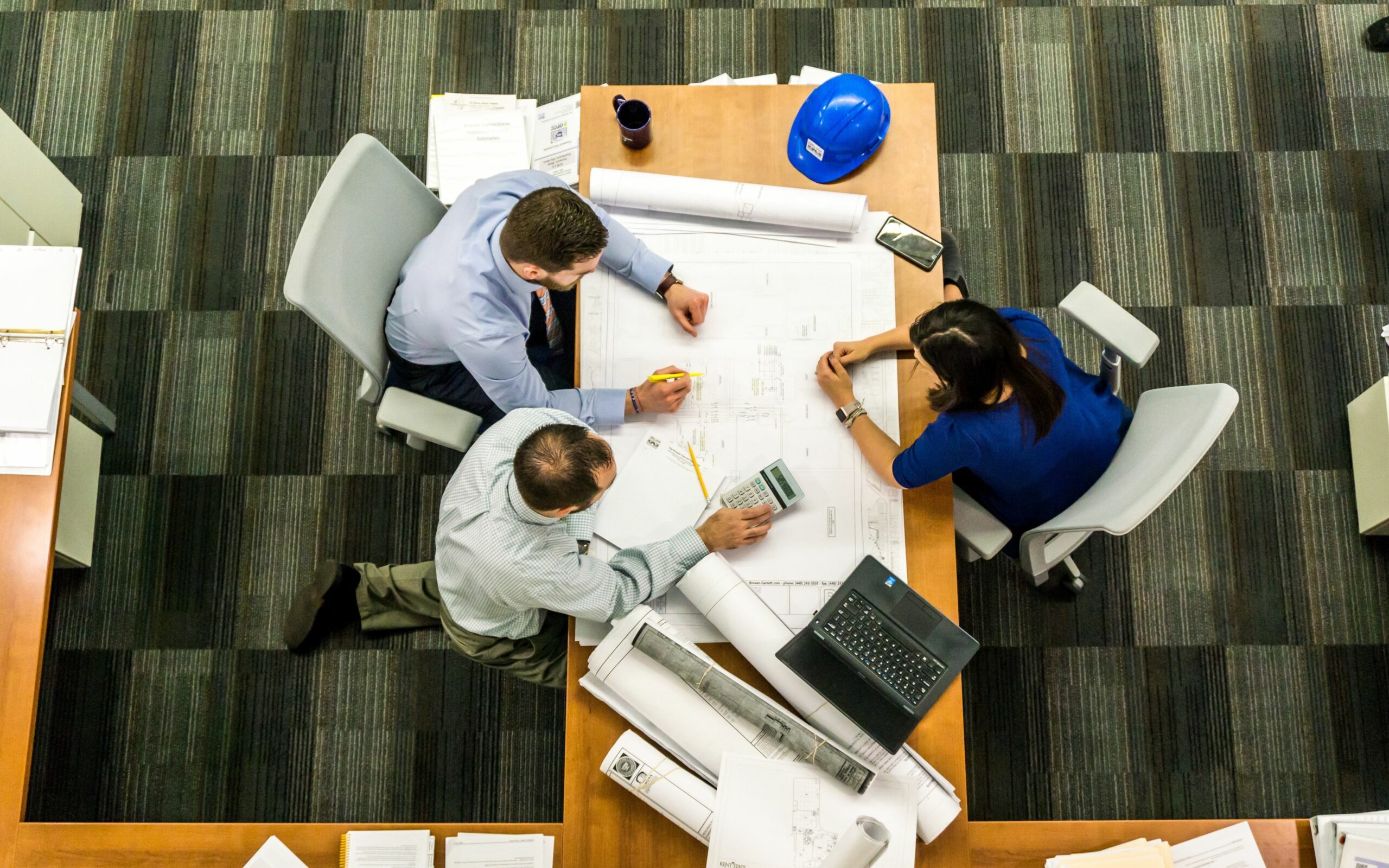 top shot showing three people in a meeting