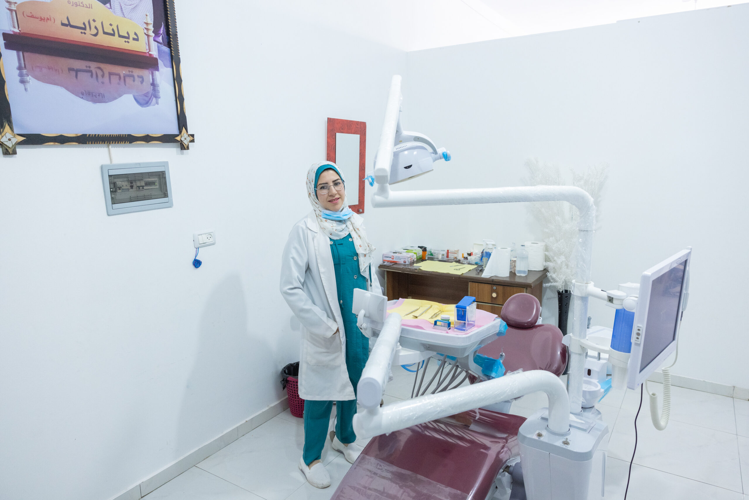 Woman dentist standing in her practice in Gaza, Palestine.